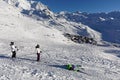 View of the Val Thorens ski resort of Three Valleys, France, with 3 skiers Royalty Free Stock Photo