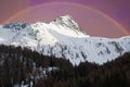 View of Valle Aurina with beautiful rainbow in the winter season, Alto Adige, Italy