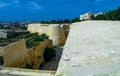 View from the Valletta City Gate bridge to Valletta Ditch and St. John\'s Bastion in Valletta, Malta Royalty Free Stock Photo