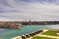 View on Valletta Grand harbor from the historic Upper Barraka garden area in Malta with historic line of cannons-Saluting Battery