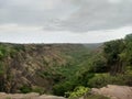 The view of a valley from a cliff with green forest and plants during monsoons in india Royalty Free Stock Photo