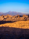 View of the Valley of the Moon in San Pedro de Atacama at sunset. In the background the volcano Licancabur and the Juriques Royalty Free Stock Photo
