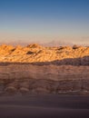 View of the Valley of the Moon in San Pedro de Atacama at sunset. In the background the volcano Licancabur and the Juriques Royalty Free Stock Photo