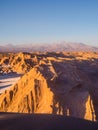 View of the Valley of the Moon in San Pedro de Atacama at sunset. In the background the volcano Licancabur and the Juriques Royalty Free Stock Photo