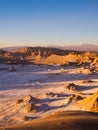 View of the Valley of the Moon in San Pedro de Atacama at sunset. In the background the volcano Licancabur and the Juriques Royalty Free Stock Photo