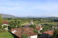 View of a valley with a rural settlement from the ancient stone wall of Rozafa Castle in Shkoder, Albania Royalty Free Stock Photo