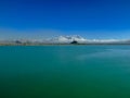 The view of Van castle from lake. Snowy mountains background. Artos mountain. Turkey