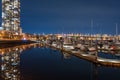 View of Vancouver downtown marina at night. Beautiful buildings skyline reflection on the water. Canada. Royalty Free Stock Photo