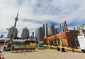 View of various condo and office stylish modern buildings with cn tower behind, against blue sky background Royalty Free Stock Photo