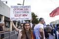 View of various participants, in the annual Pride Parade of the LGBTQ. Girl holding a poster: Russian government criminalizes