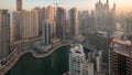 View of various skyscrapers in tallest recidential block in Dubai Marina aerial night to day timelapse Royalty Free Stock Photo