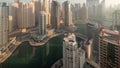 View of various skyscrapers in tallest recidential block in Dubai Marina aerial night to day timelapse Royalty Free Stock Photo