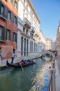 Tourists are sailing in gondola along the canal and sightseeing in Venice, Italy