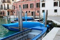 View of the Venice street, blue water and boats concept photo. Boat and motorboat on water.