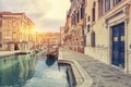View of The Venice Street And Canal with boats in Venice, Italy.