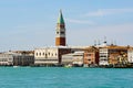 The view of Venice waterfront and St Mark`s Campanile and Doge`s Palace on a beautiful sunny day