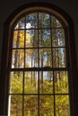 View of Vermont fall foliage from an arched window. Royalty Free Stock Photo