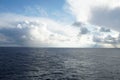 View from vessel on heavy rainfall clouds bringing abundant rainfall and atmospheric precipitation. Royalty Free Stock Photo