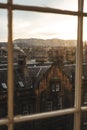 View of the vibrant cityscape of Edinburgh, Scotland, taken from a window.