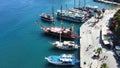 View of a vibrant marina in Marmaris, Turkey, with a variety of boats docked in the harbor