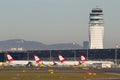 View of Vienna Airport with terminal, air traffic control tower and parking aircrafts Royalty Free Stock Photo