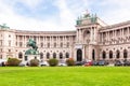 View of Vienna Hofburg Imperial Palace with Statue of Emperor Joseph II and green lawn, Royalty Free Stock Photo