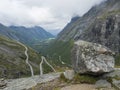 View from viewpoint platform on Trollstigen or Trolls Path, Trollstigveien famous serpentine mountain road pass and green valley