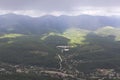 View of the village Aderbievka and Greater Caucasus Range rainy summer day Royalty Free Stock Photo