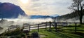 View of the village on the background of mountains. Panoramic view of foggy morning. View from the terrace.