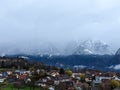 View of the village on the background of mountains. Panoramic view of foggy morning. View from the terrace.