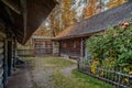 View of the village courtyard on autumn nature background.