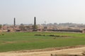 A view of village life and fields with brick kiln