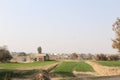 A view of village life and fields with houses