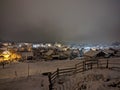 View of the village at night in winter. View from the terrace