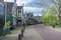 View on the village street of the old village of Zaanse Schans in Zaandam, you can see the traditional wooden construction of the Royalty Free Stock Photo