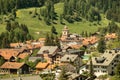 View of a village in the swiss alps with meadows Royalty Free Stock Photo