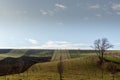 View of vineyards and farms in the Svatoborice region of Moravian Tuscany during a sunny autumn day in the background blue sky