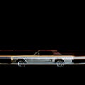 A view of a vintage classic American muscle sports car and light trails by traffic in Venice beach, California at night time Royalty Free Stock Photo