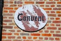 View on vintage retro sign with lettering convent at red monastery brick wall - Lier Begijnhof, Belgium