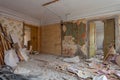 View of the vintage room with fretwork on the ceiling of the apartment and retro chandelier during under renovation, remodeling Royalty Free Stock Photo