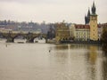 View of the Vltava River and the built up banks and Old Town Bridge Tower and famous Charles Bridge in Prague capital of the Czech Royalty Free Stock Photo