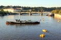 The view on Vltava river, one of the Prague bridges and big tourist boat Royalty Free Stock Photo