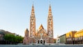 View on the Votice Church and the people on the square in Szeged, Hungary at night