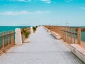 The view of the walking path on the breakwater in the small port Royalty Free Stock Photo