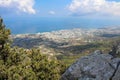 View from the wall of the castle of Saint Hilarion on the city of Kyrenia, clouds and the Mediterranean sea. Cyprus Royalty Free Stock Photo