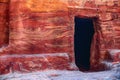 View of the wall with the door, the entrance to the temple in the canyon. Petra, Jordan.