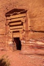 View of the wall with the door, the entrance to the temple in the canyon. Petra, Jordan.