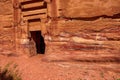 View of the wall with the door, the entrance to the temple in the canyon. Petra, Jordan.