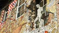 Ljubljana, Slovenia - 07/19/2015 - View of wall paintings and scuptures in Metelkova quarter houses, sunny day Royalty Free Stock Photo