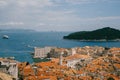 View from the wall on the roofs of the old city of Dubrovnik, the bell tower of the Dominican monastery, the dome of the